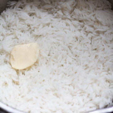 cooked rice and a knob of butter in a saucepan.