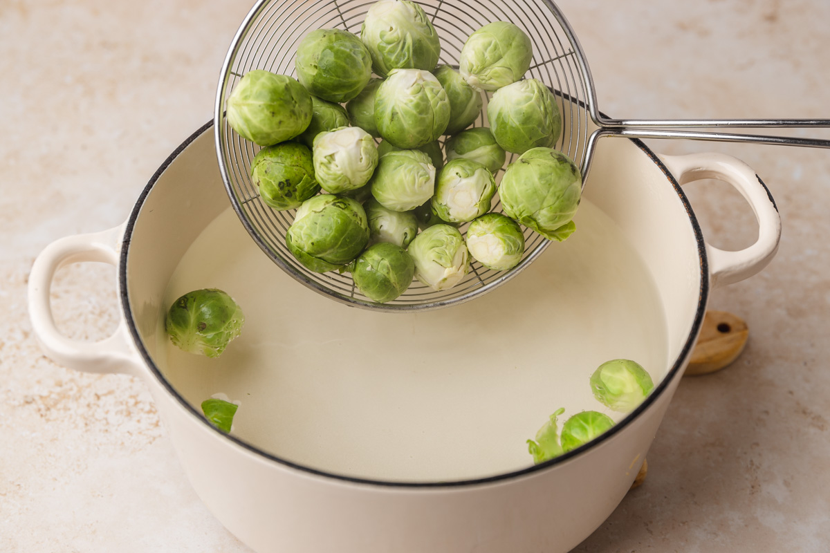 brussels sprouts in a big slotted spoon.