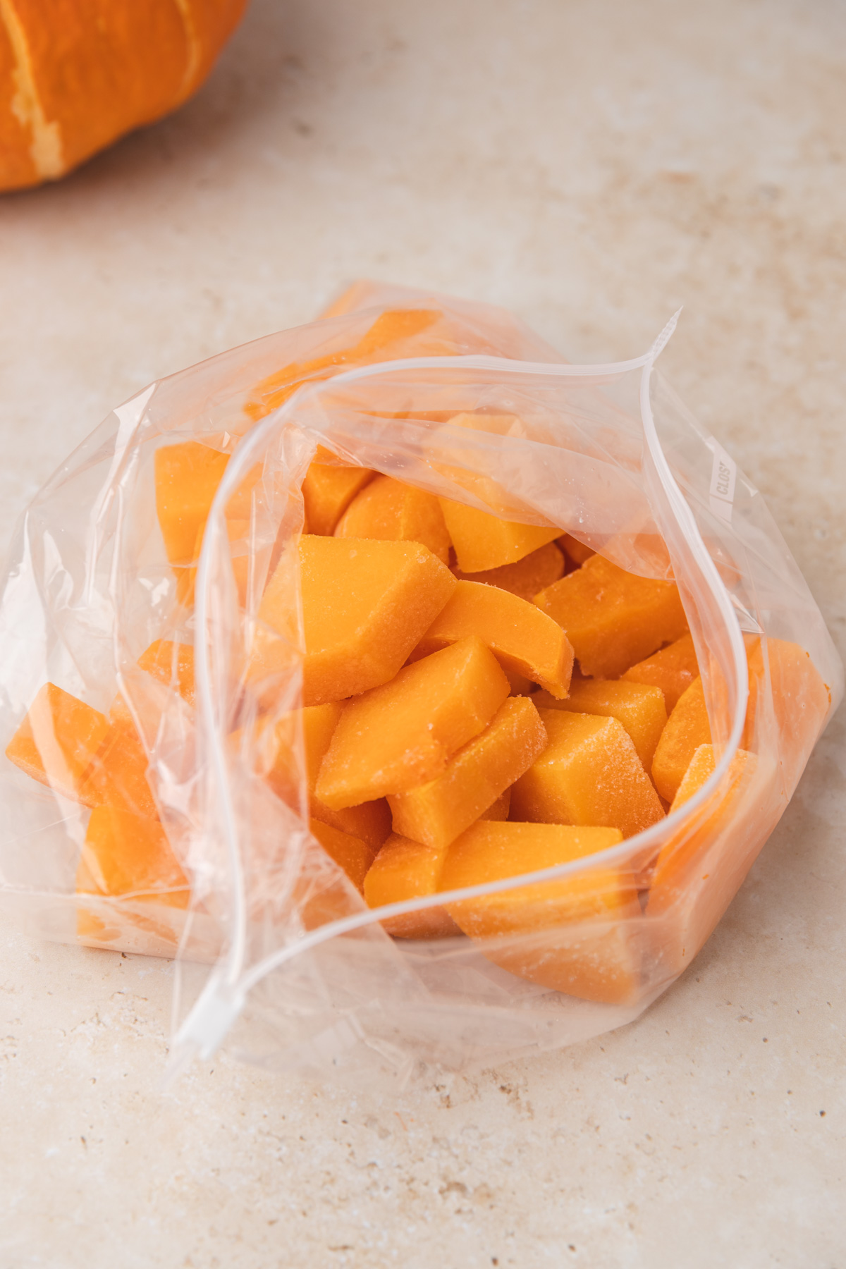 cubed buternut squash in a freezer bag.