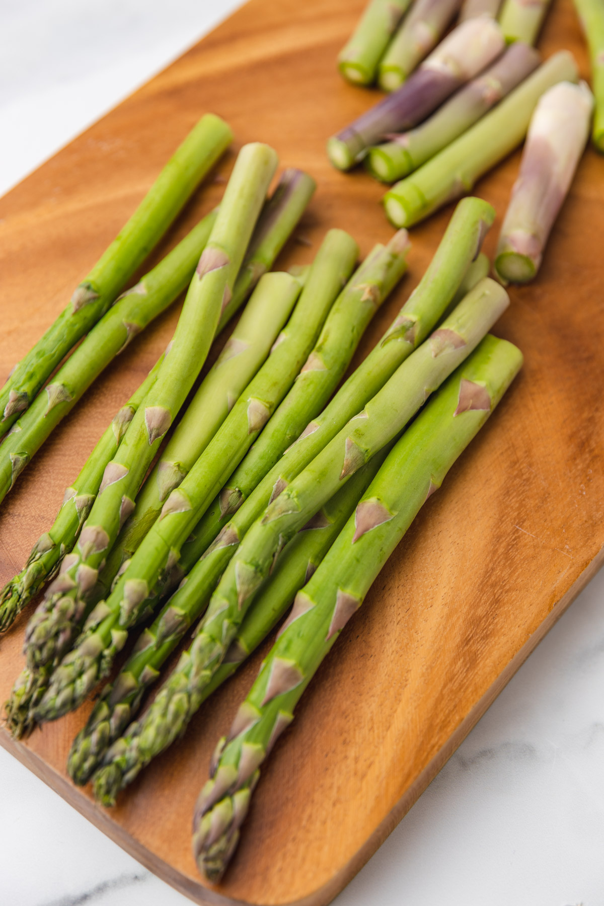 sliced asparagus on a chopping board.