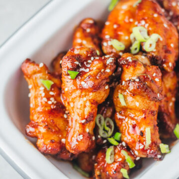 sticky chicken wings in a serving bowl.